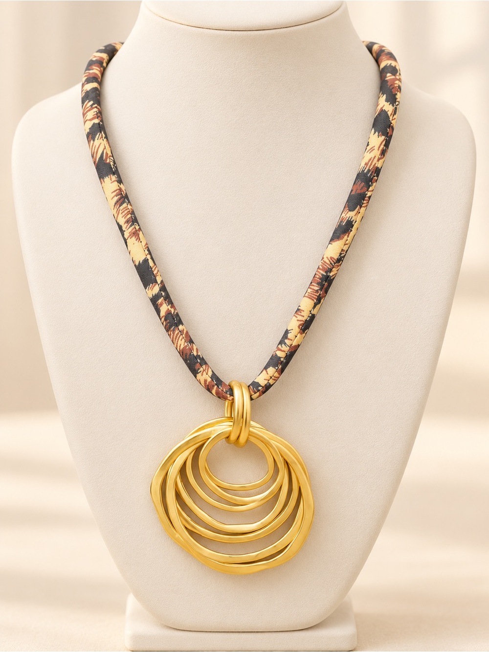 Gold Multi-Ring Pendant Necklace with Black and Tan Fabric Cord